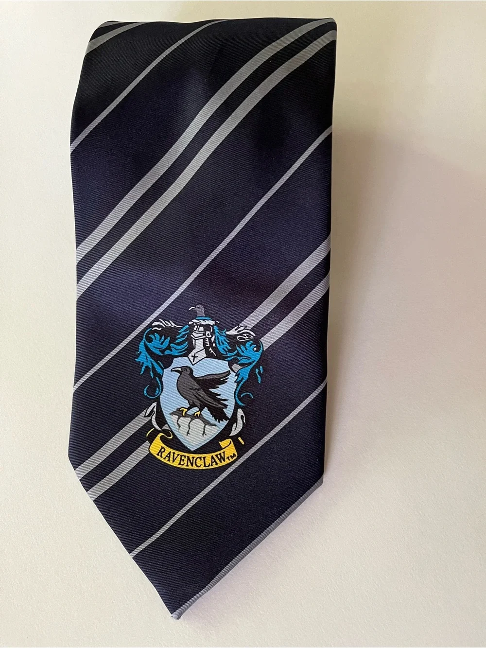Harry Potter Ravenclaw Crest Diagonal Stripe Tie - Black & Gray with Blue Accent